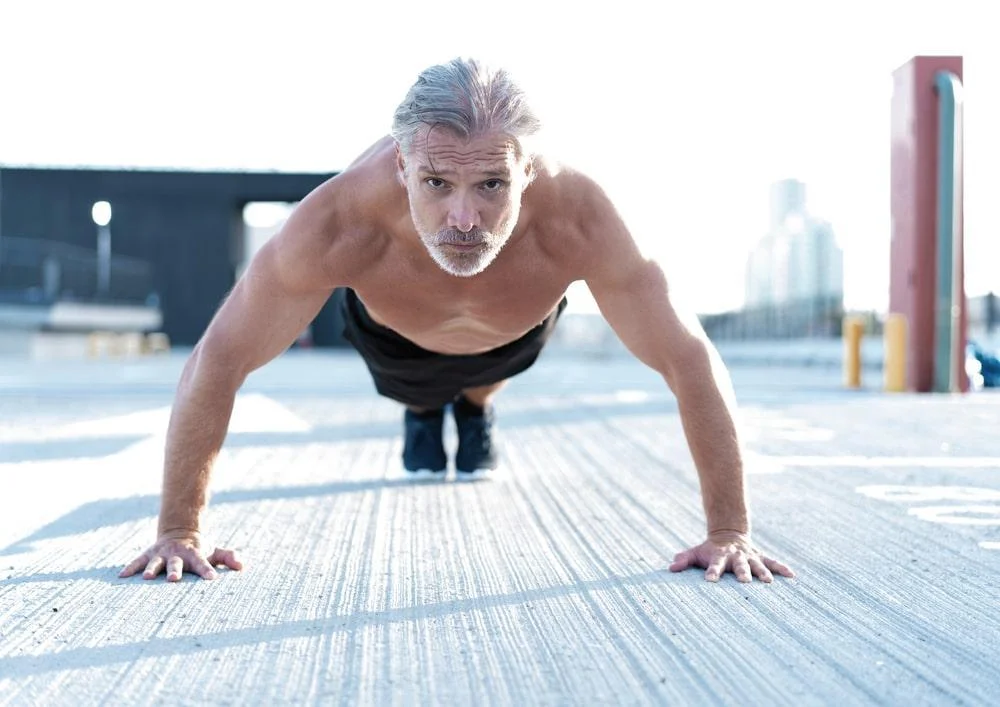 A man exercising and doing push ups