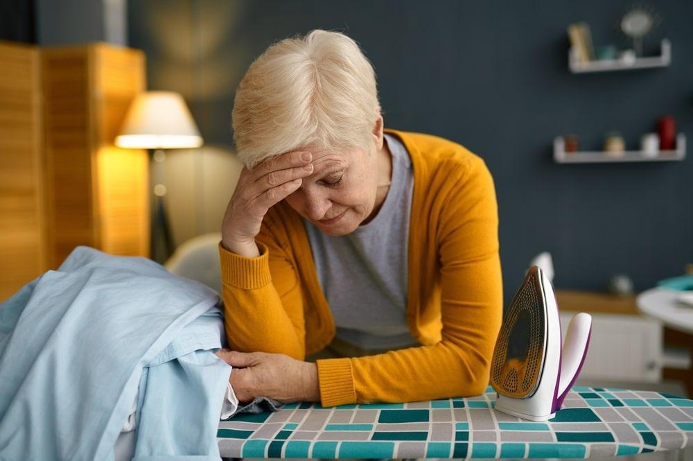 A woman experiencing Fatigue and Weakness