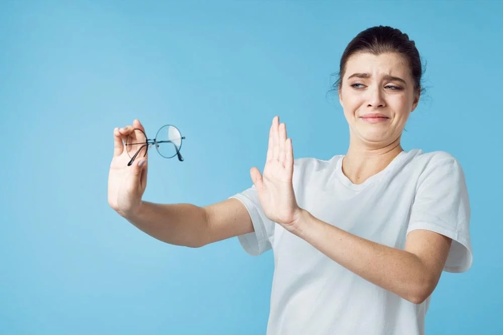Woman Neglecting Glasses After Learning on How to Improve Your Eye Vision
