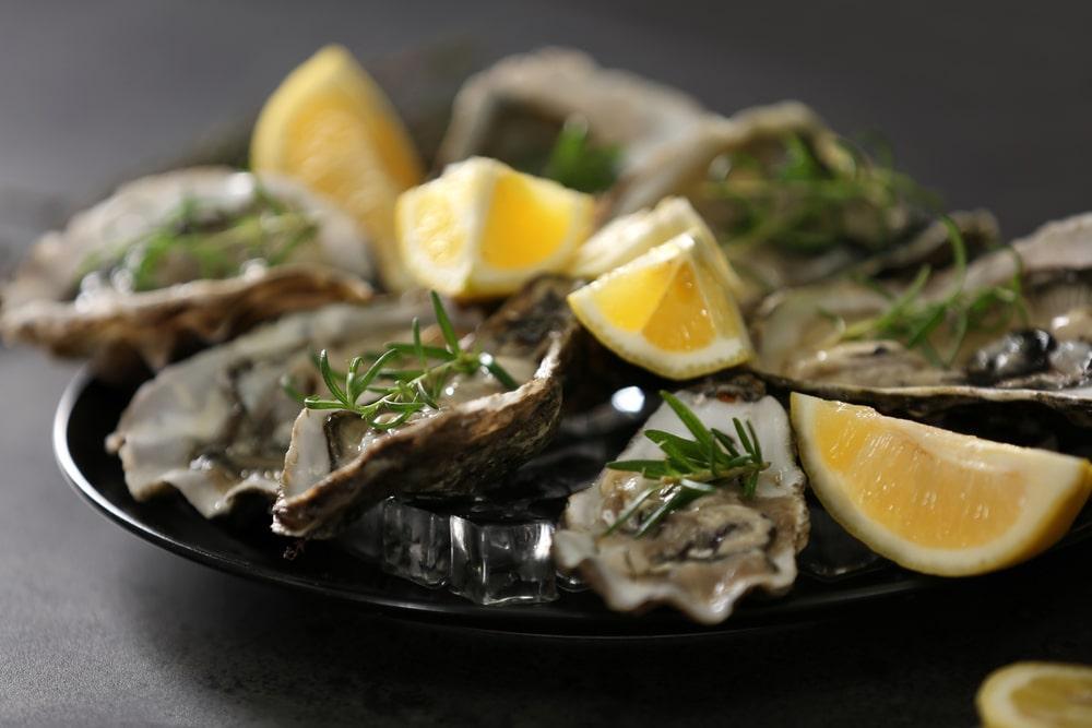 A Plate of Oysters With Lemons and Rosemary
