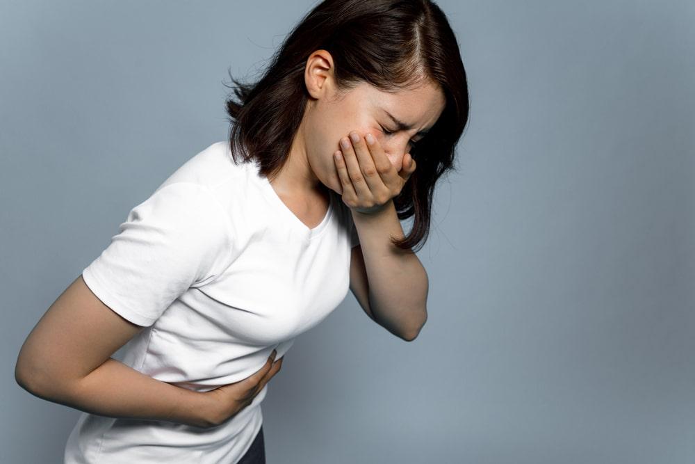 Woman Vomiting with Blood