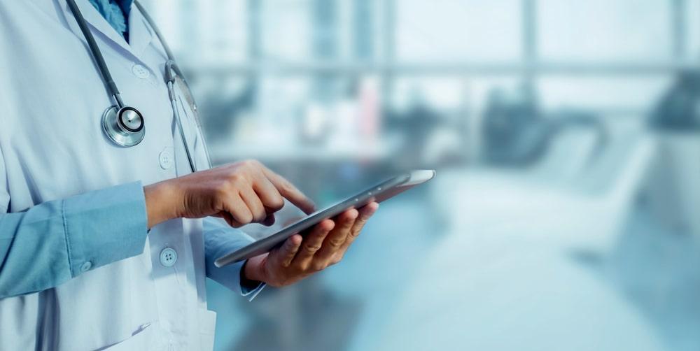 A Doctor Using a Tablet