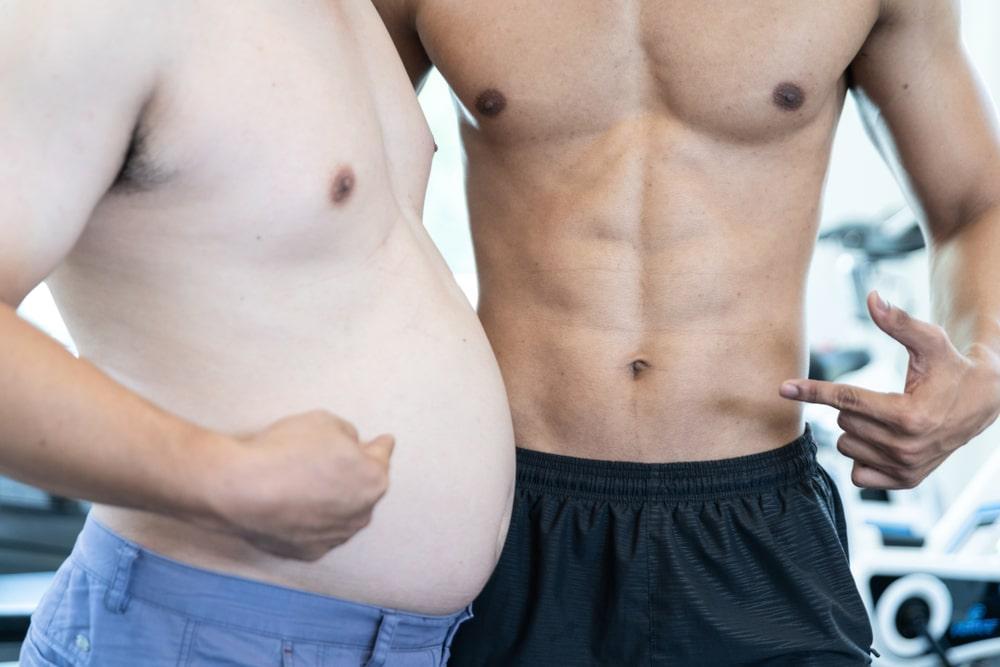 Two Men Point a Finger to Their Belly of Different Fat Percentage