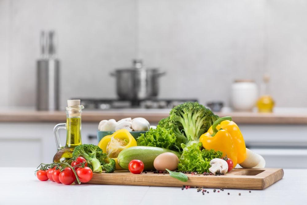 A Wooden Cutting Board With Vegetables