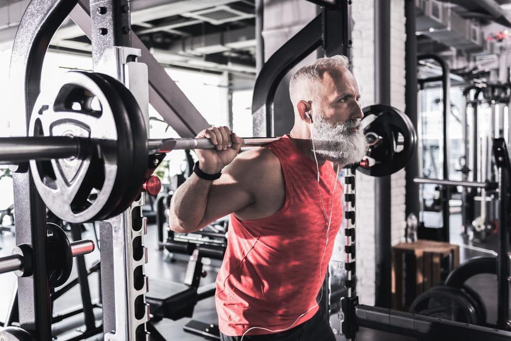 Mature Male Is Having Intense Workout in the Gym