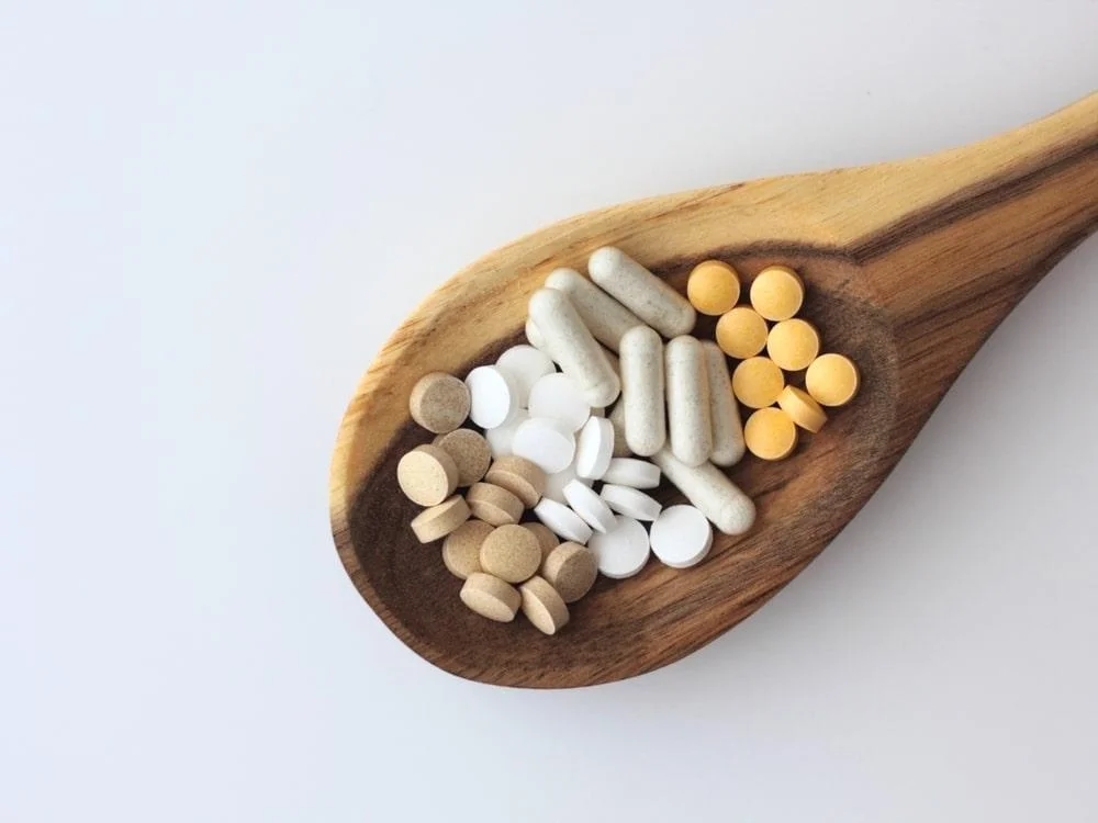 B Vitamins on a Wooden Spoon