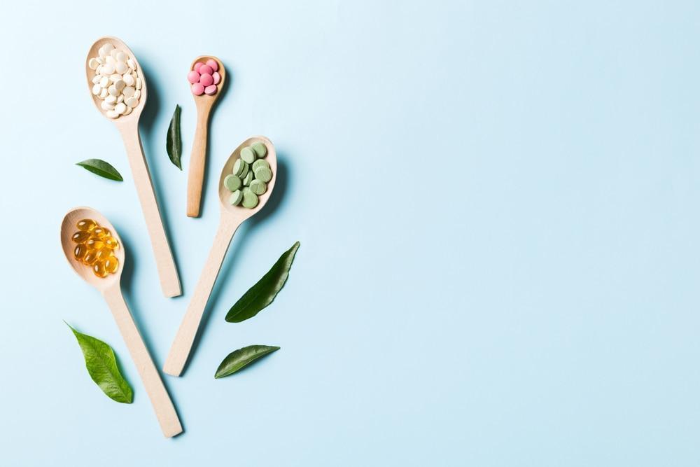 Vitamin A Supplements on Wooden Spoons