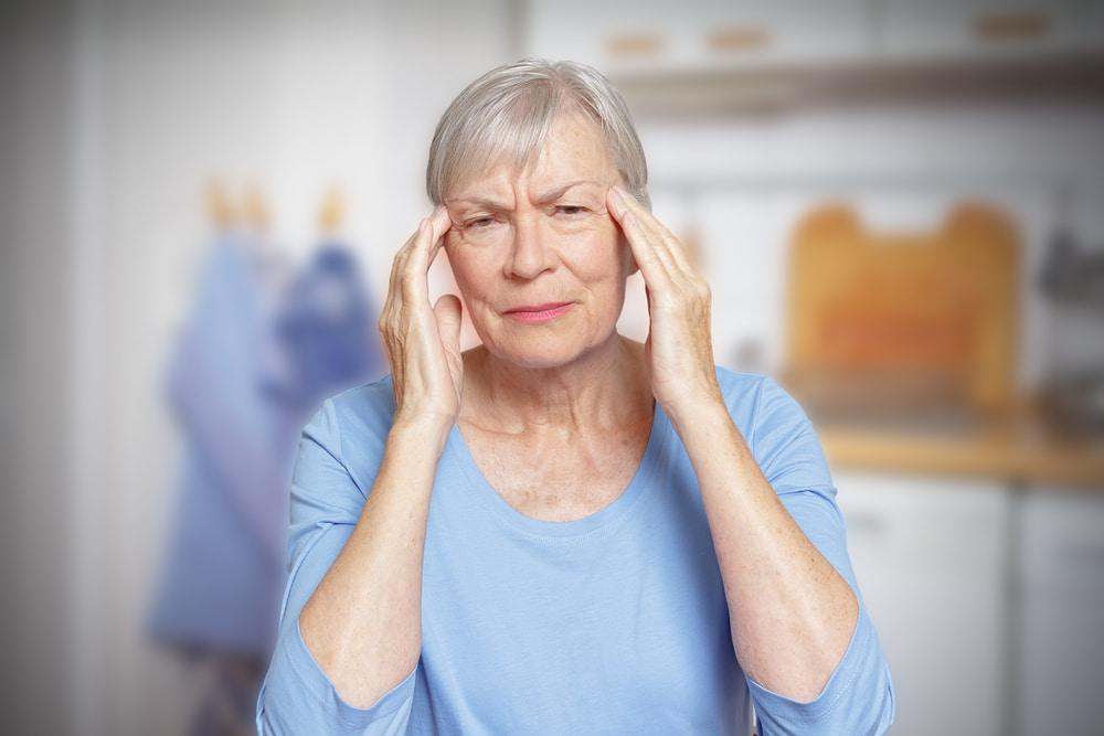 A Woman Suffering From Menopause Brain Fog Before Taking the 8 Best Supplements for Menopause Brain Fog