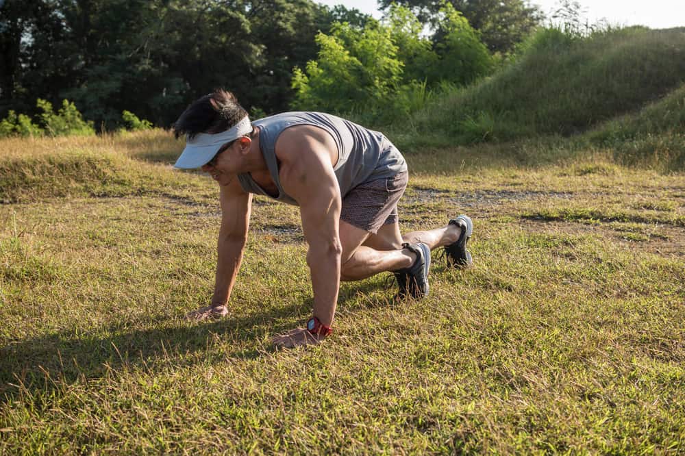 An Athletic Asian Man Does Mountain Climbers