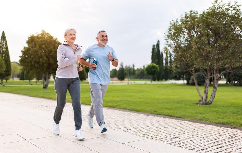 Joyful Retirees Couple Jogging