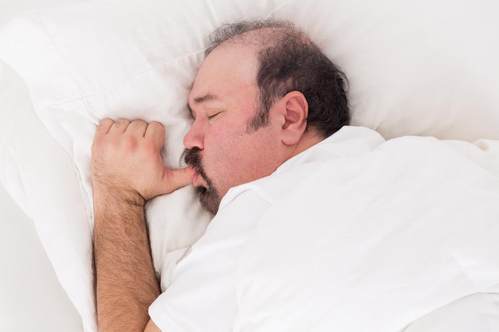 Man Snuggling Into His Pillow Sucking His Thumb Like a Big Baby