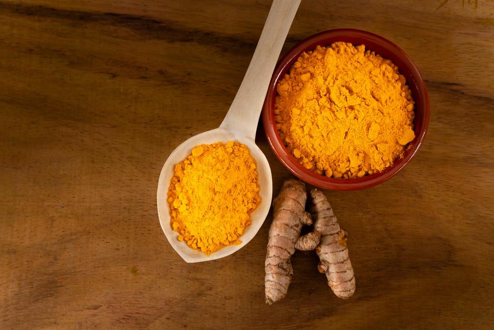 A bowl and a spoon of Turmeric