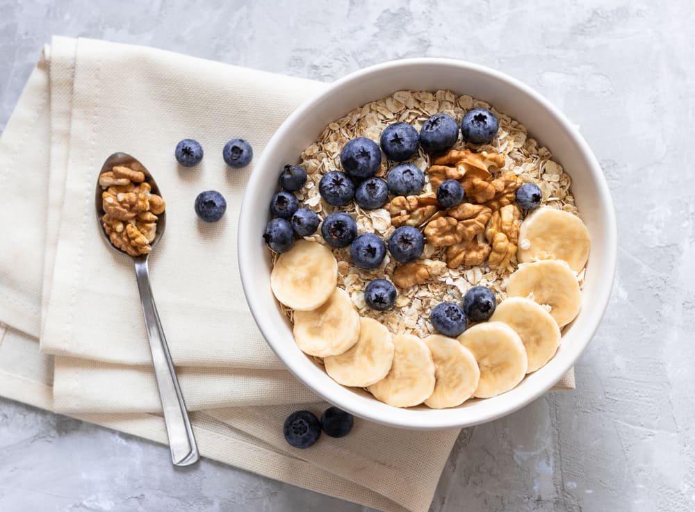 Porridge With Bananas, Blueberries and Walnut for Healthy Breakfast
