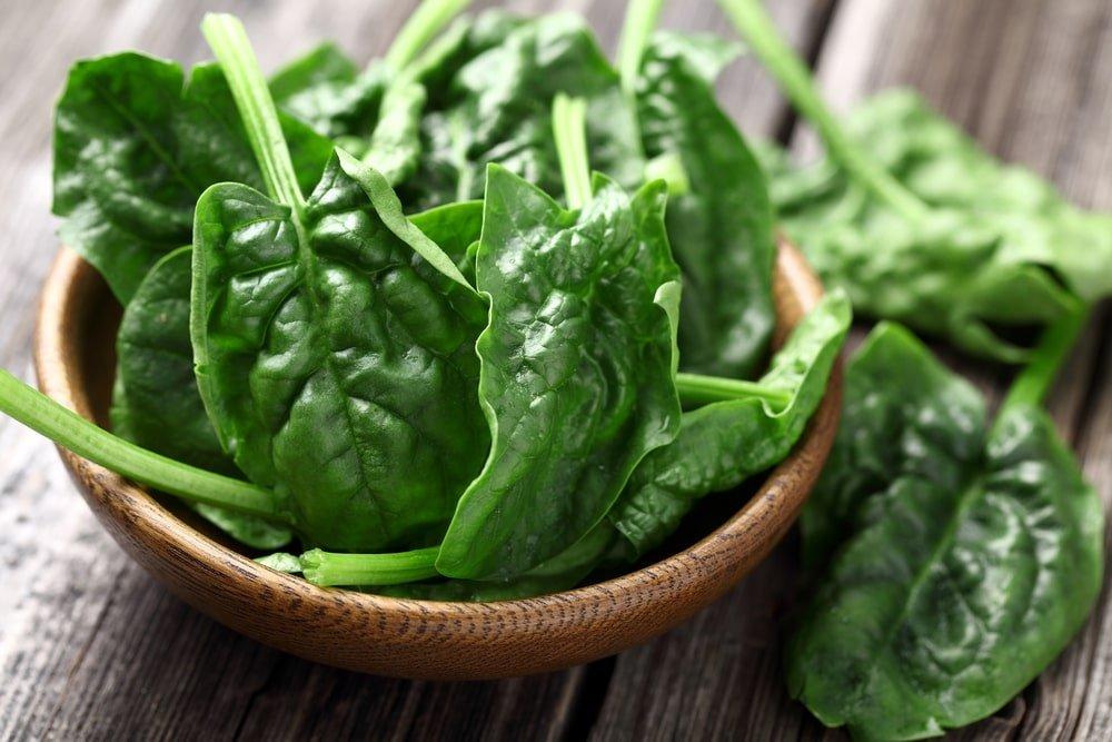 Spinach Leaves in a Wooden Plate