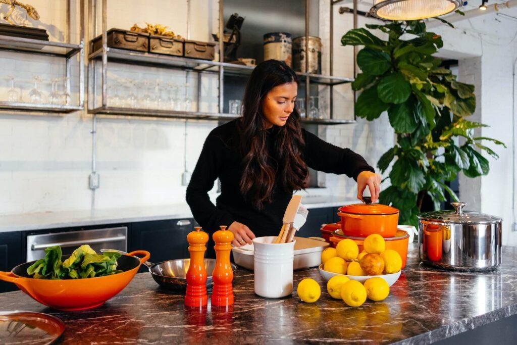 Woman cooking healthy food in the kitchen