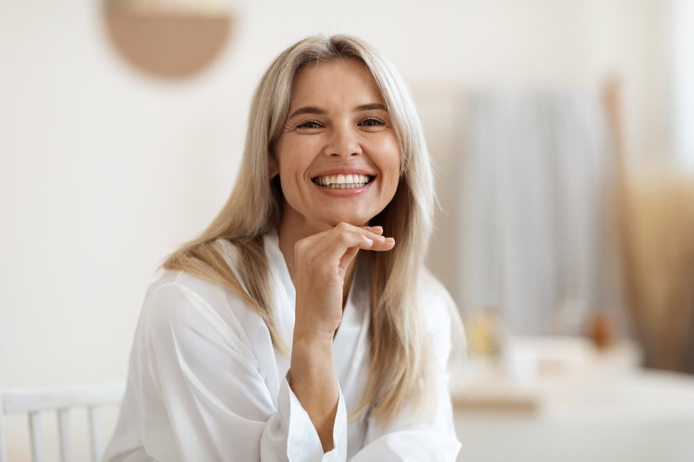 A Happy Woman Smiling at Camera