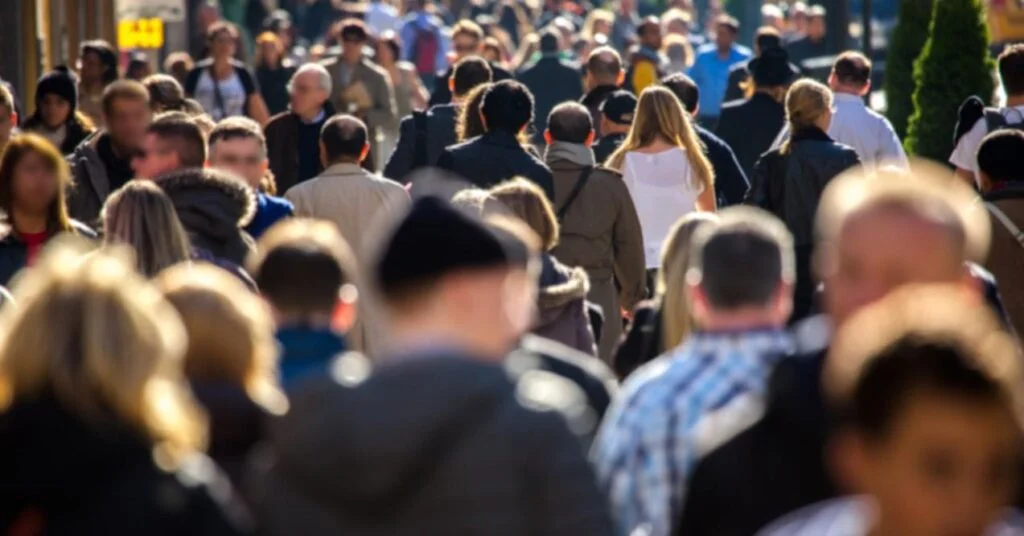Anonymous Crowd of People Walking on a Busy Street