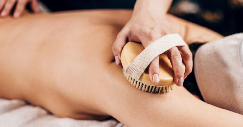 A Woman Is Having a Deep Skin Brushing Massage