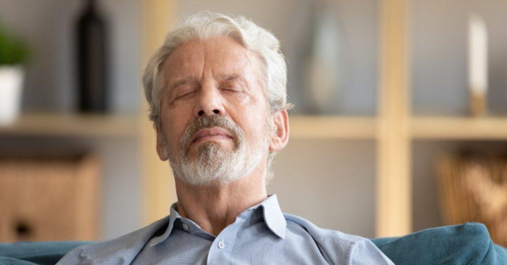 Man Relaxing and Breathing Deeply