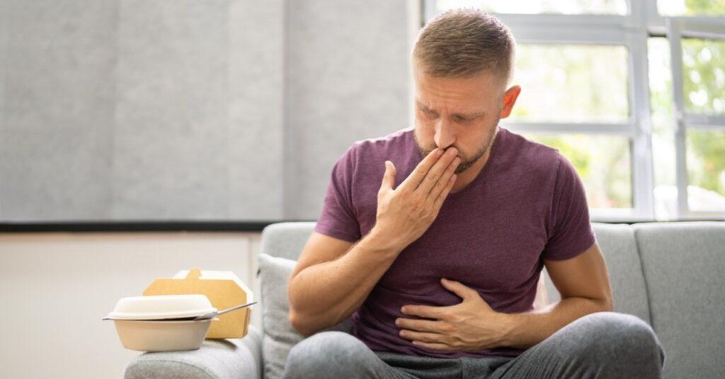 Man Experiencing Stomach Heartburn