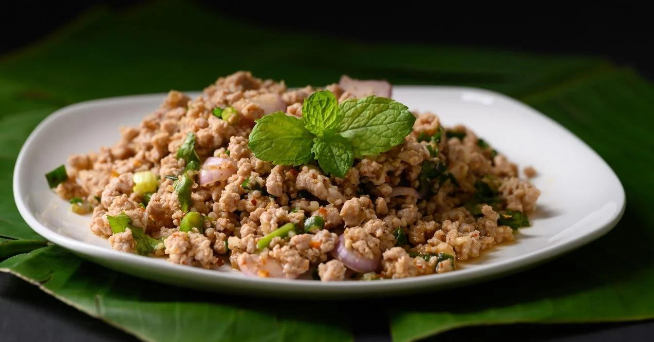 Zoomed in minced meat on a white plate dark background