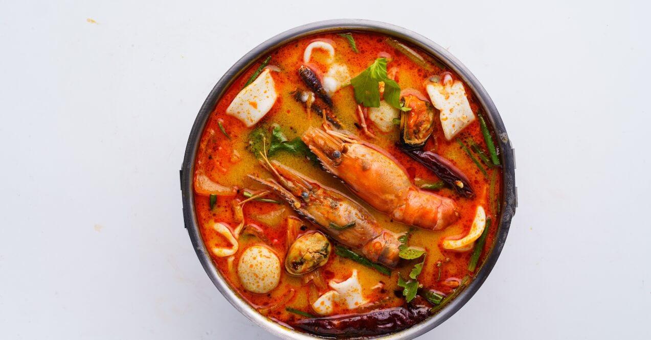 Thai food, Tom Yam Kung in white bowl on white background