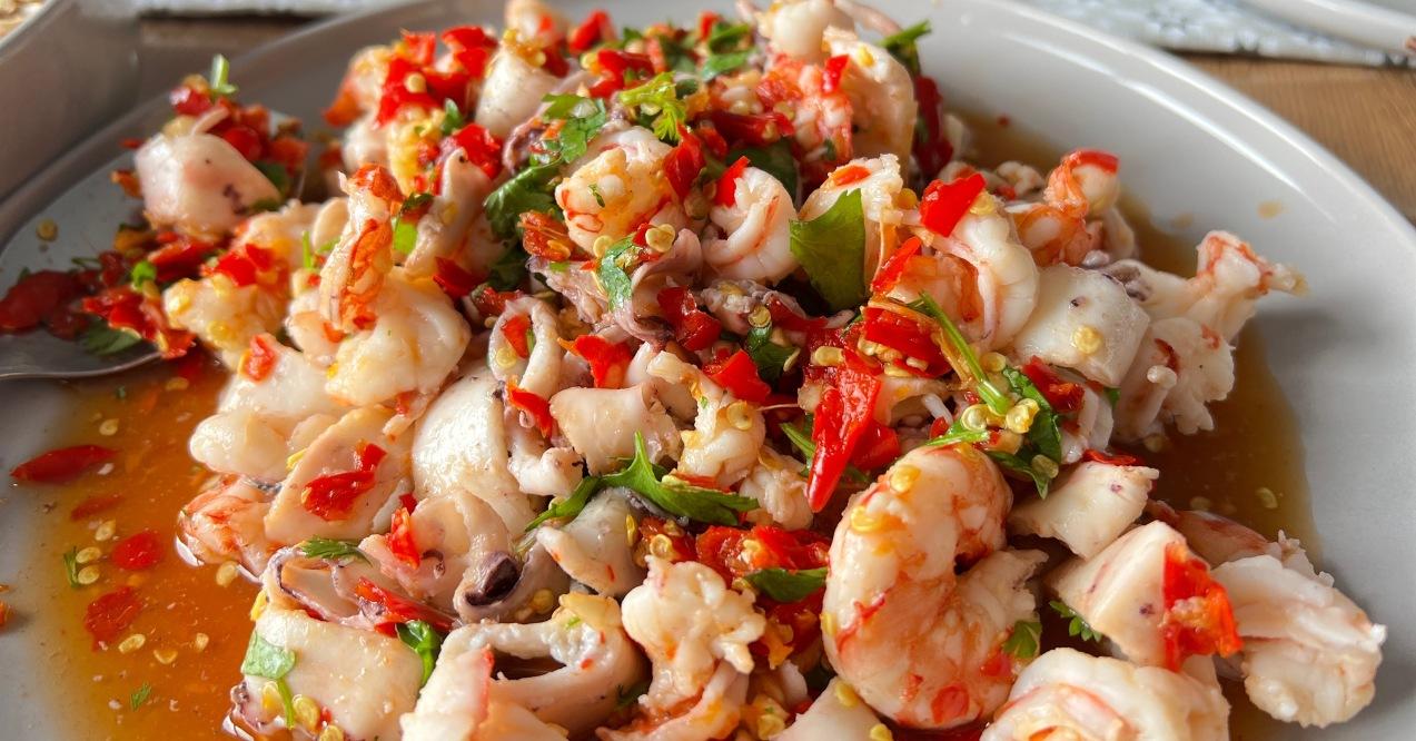 Zoomed in spicy seafood salad with prawns and squid