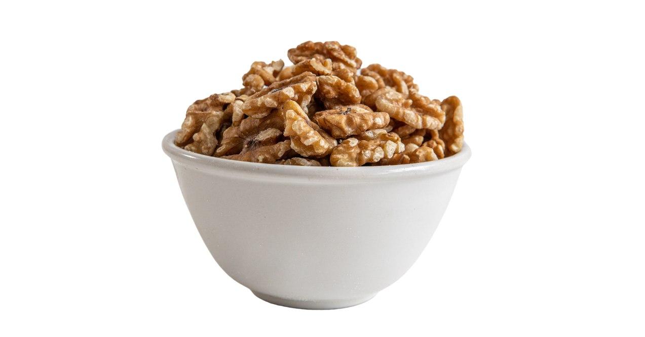 A bowl of walnuts in white background