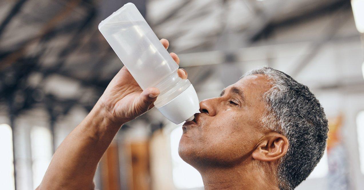 Man Drinking Water After Exercising