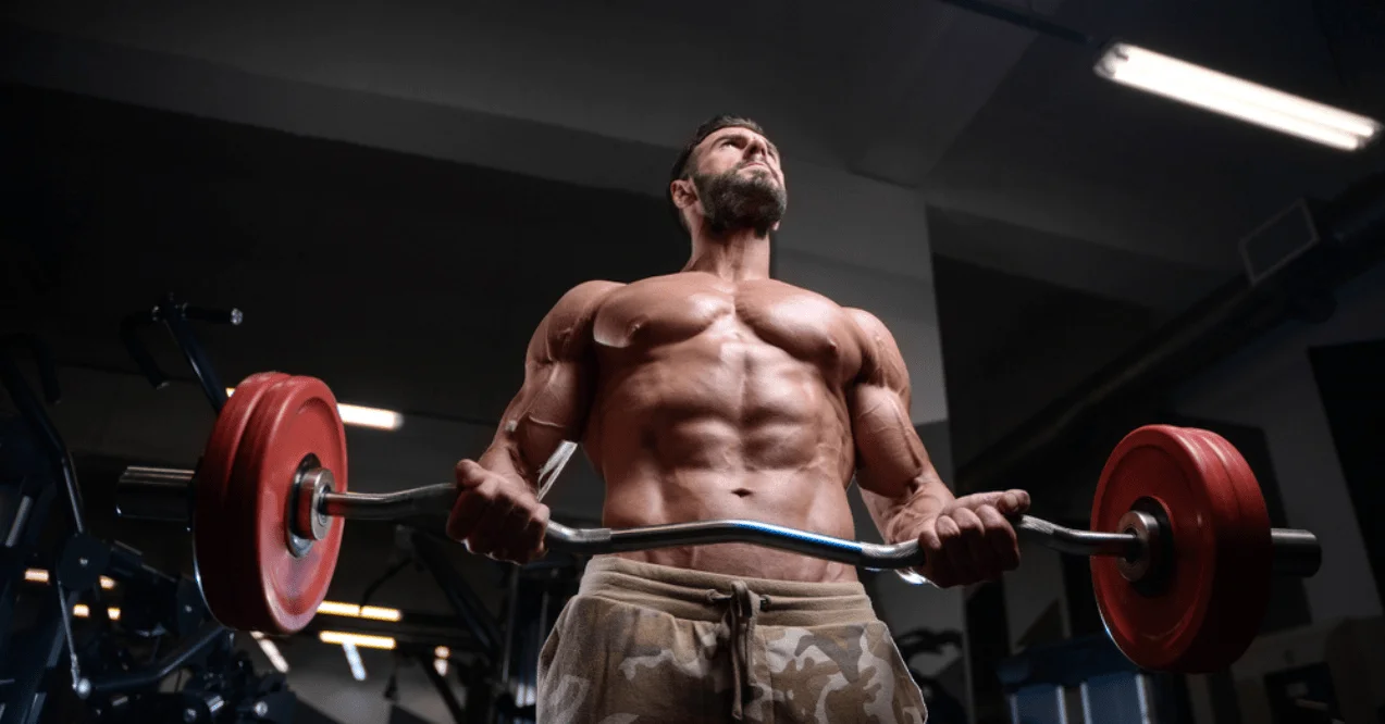 bodybuilder doing fitness health care exercises in gym