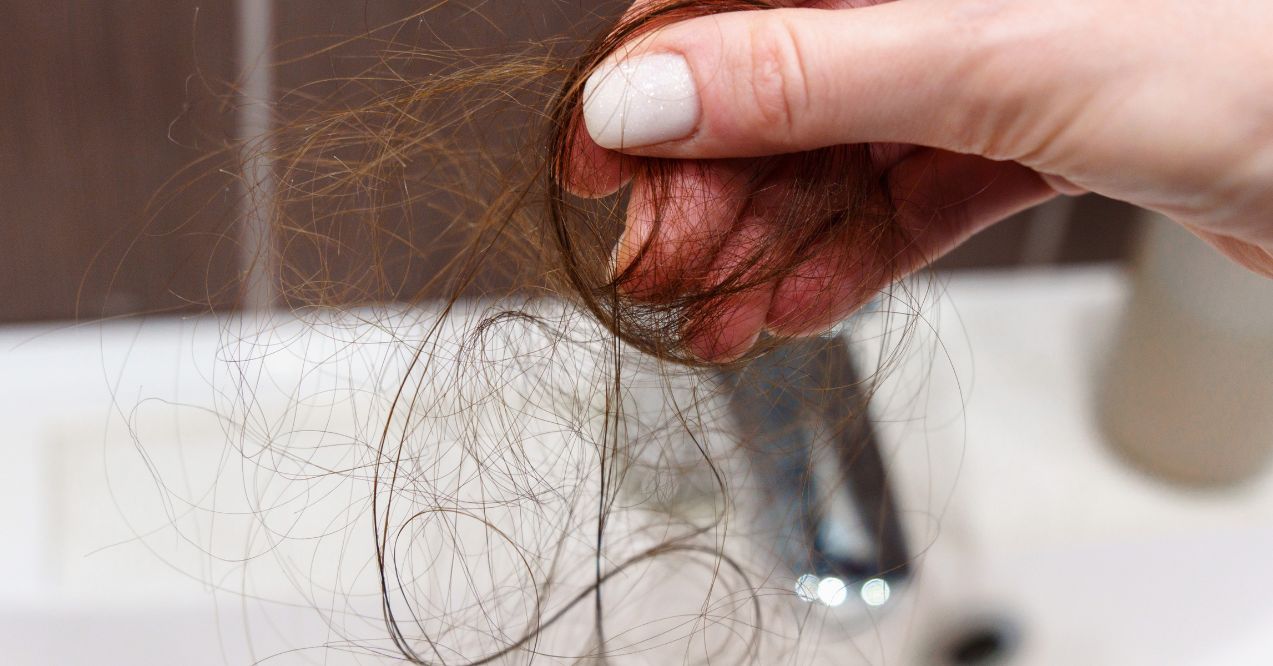 Close up reveals the challenges of an individual confronting hair loss. Selective focus
