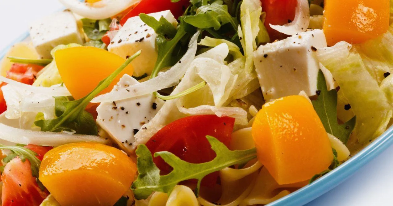 Zoomed in papaya salad with green and feta cheese