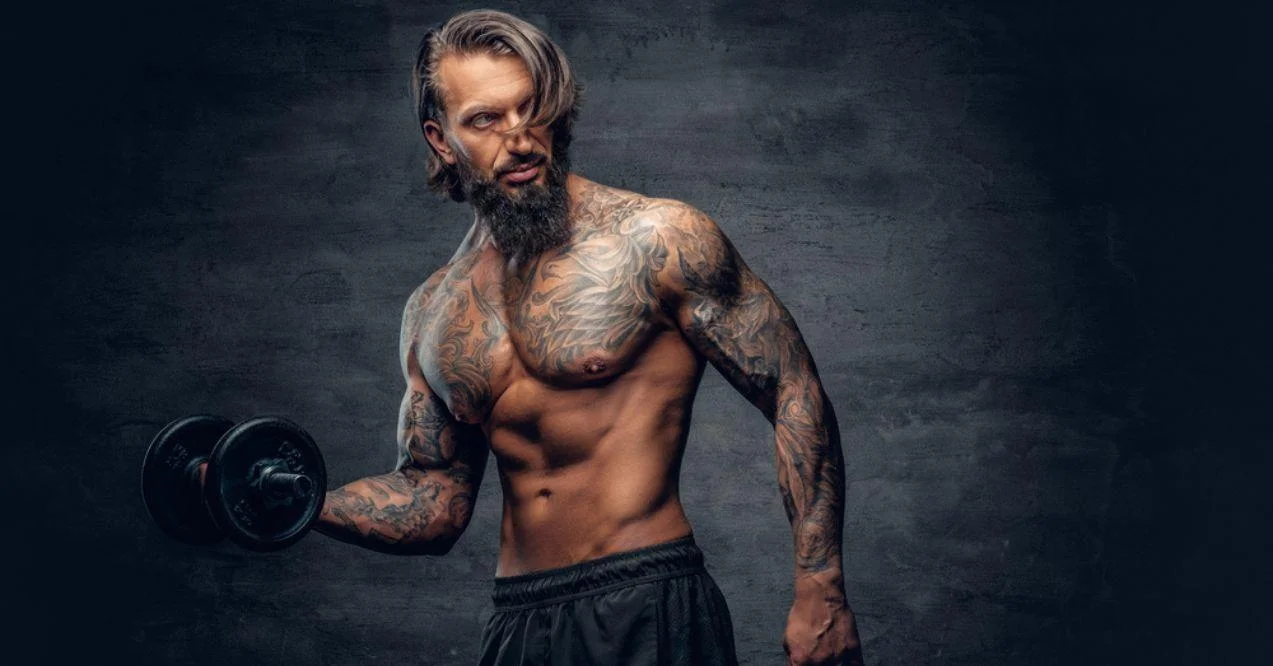 Shirtless old man posing while lifting a dumbbell