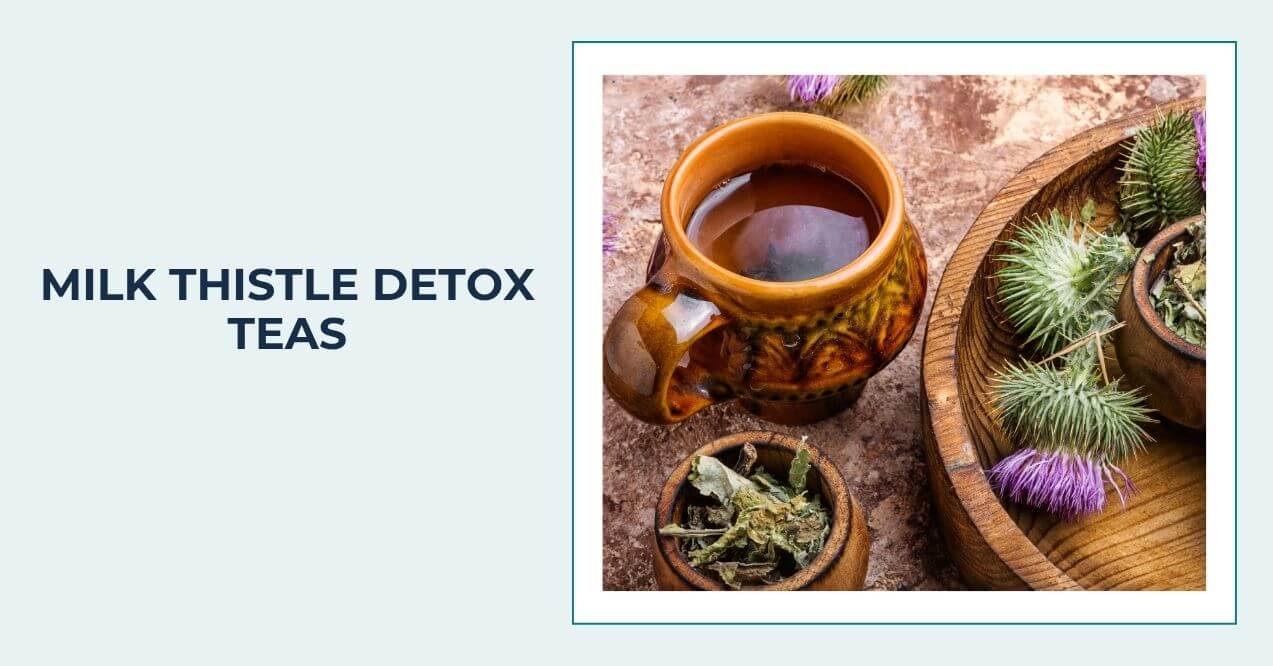 Ceramic cup of tea with milk thistle flowers and dried herbs beside it.