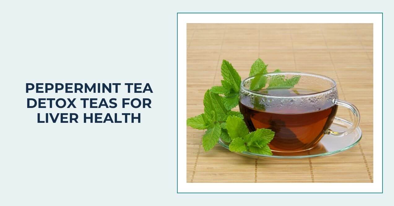 Glass cup of peppermint tea with fresh peppermint leaves.