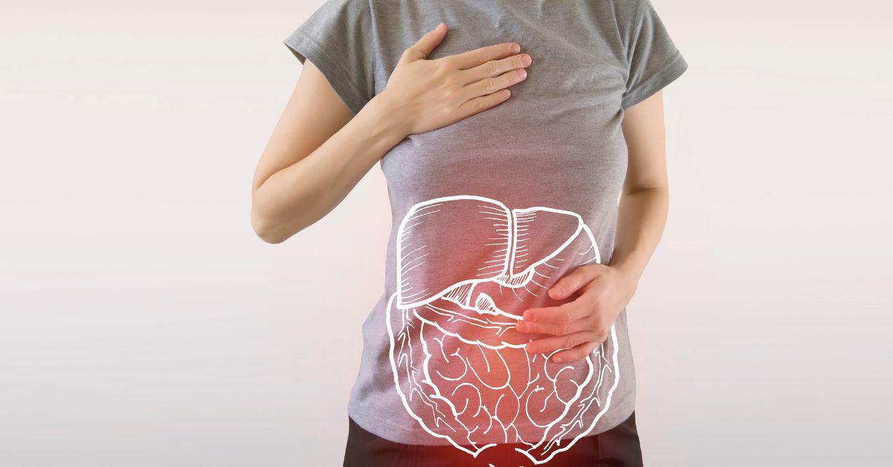 a woman is holding her hands on her stomach and chest, with a graphic of a liver on her belly