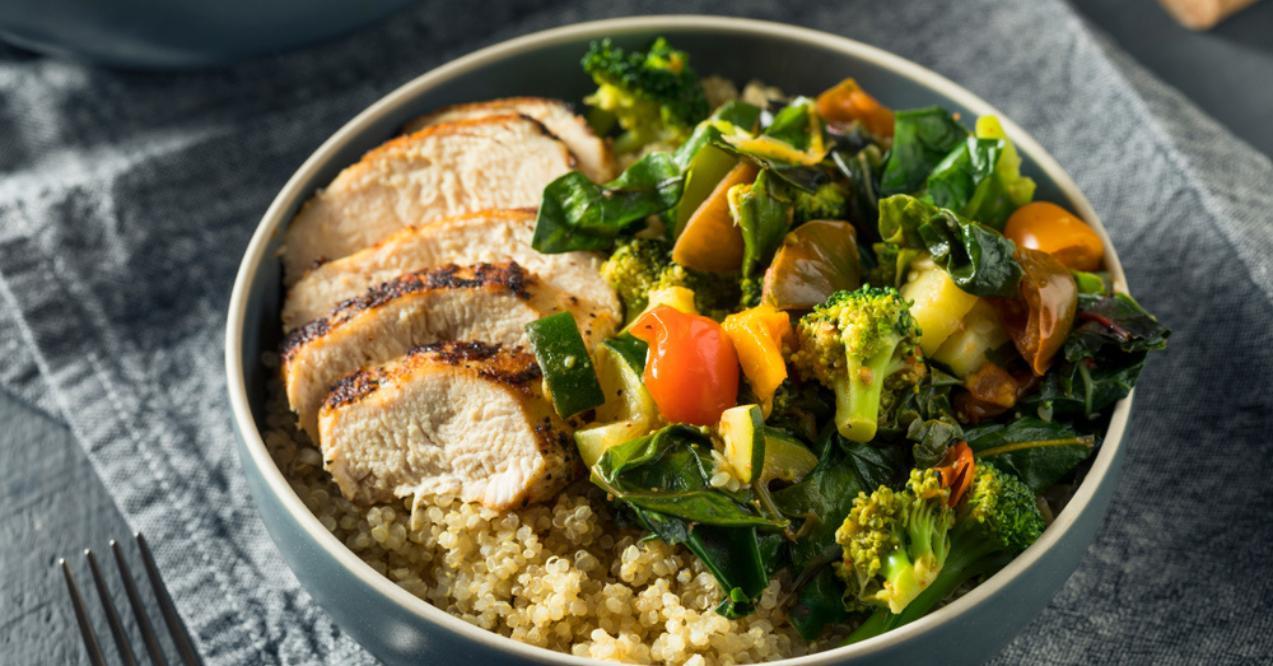 healthy chicken and quinoa bowl with roasted veggies