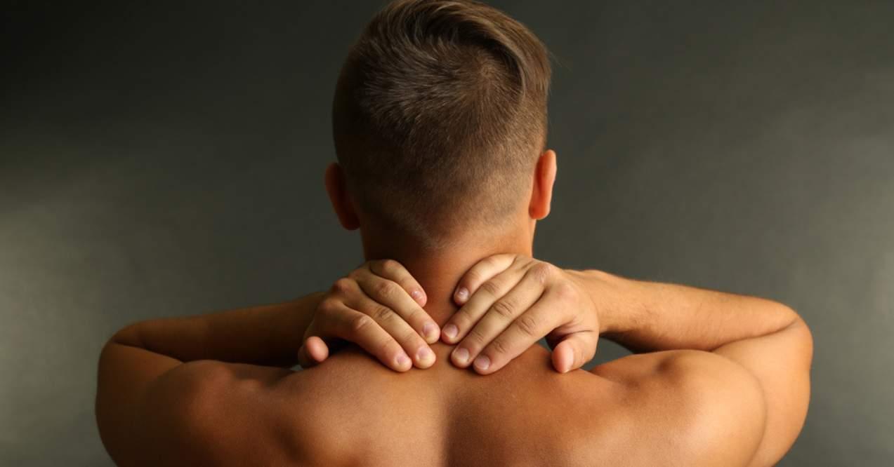 A man with stiff back muscles 