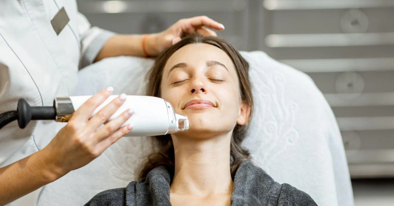 woman is getting a laser treatment