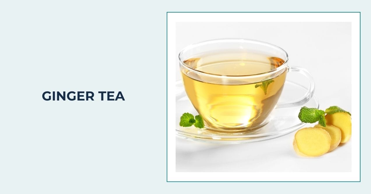 Glass cup of ginger tea with fresh ginger slices and mint leaves on white background.