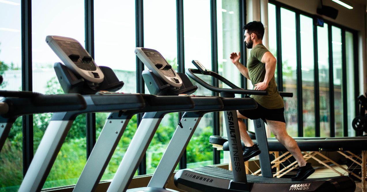 a man is running on a treadmill