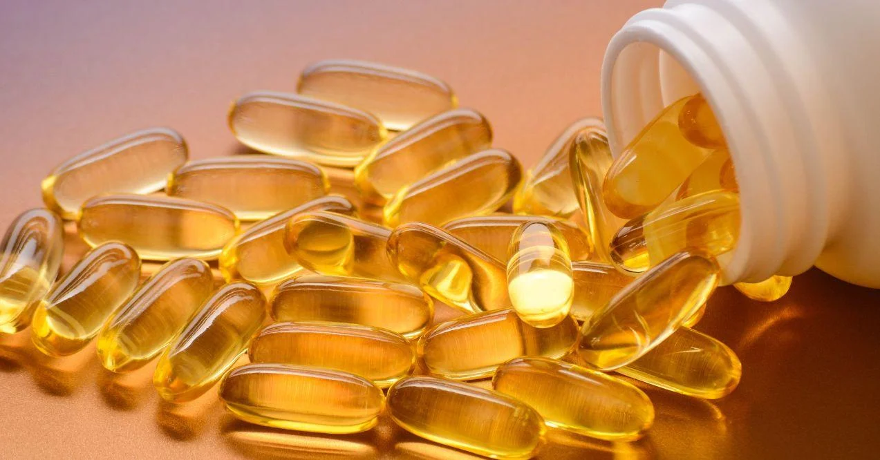 A spilt bottle of vitamin d capsules