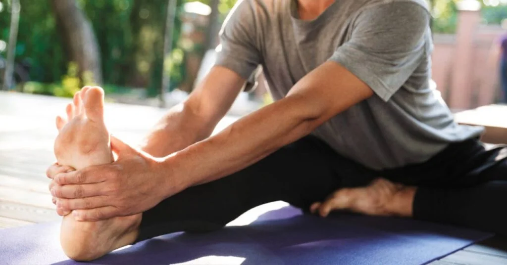 A man stretching his feet