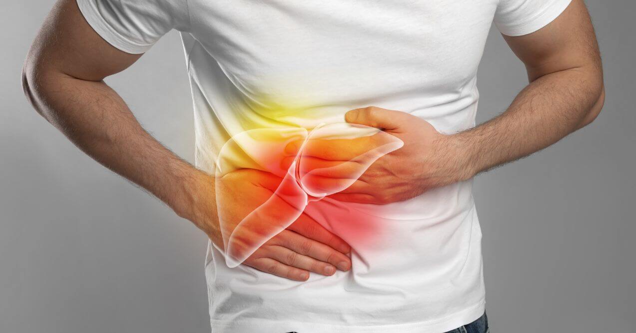 Person holding their right side in discomfort, with an illustration of the liver highlighted in pain.