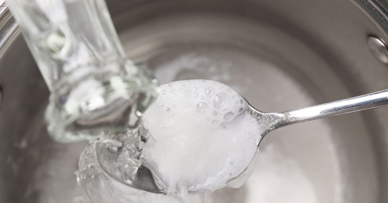 Mixing a vinegar solution for foot care and hygiene.