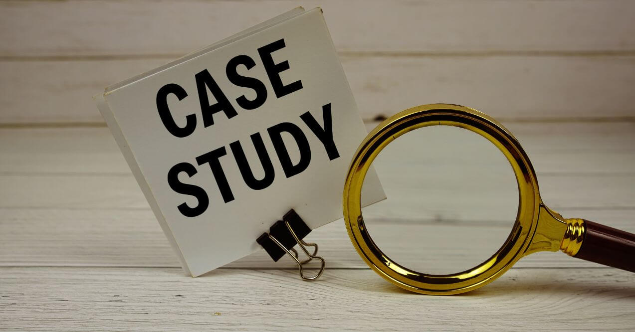 Case study note with a magnifying glass on a wooden table