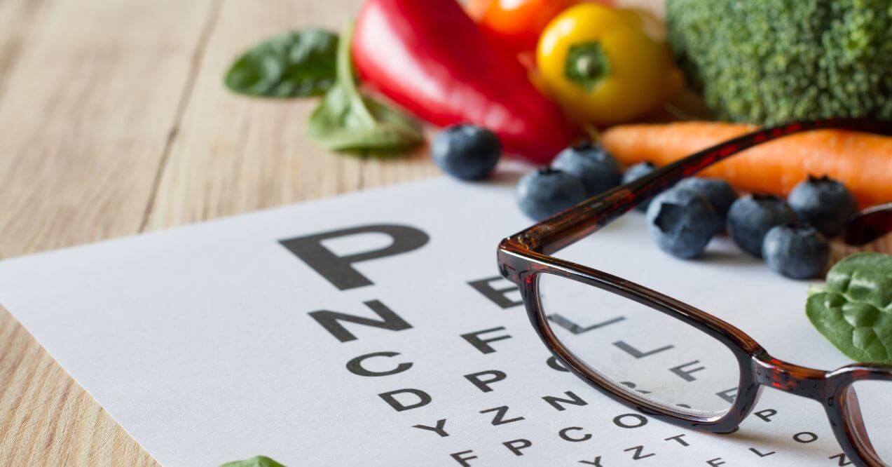 Healthy foods and eye chart representing a vision-improving diet.