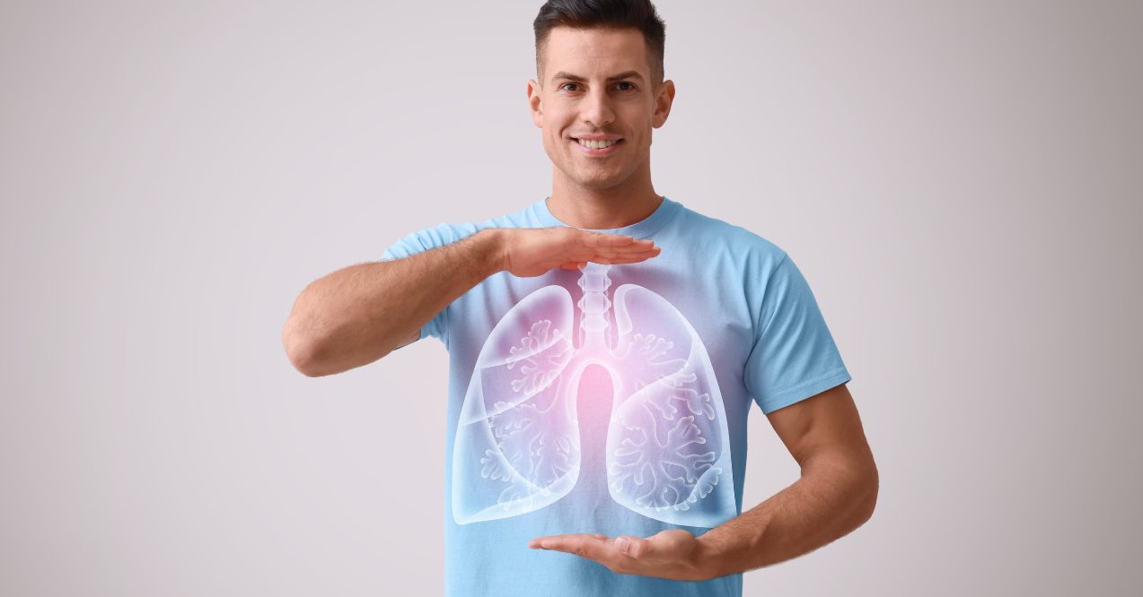 A man showcasing healthy lungs, demonstrating tips on how to improve lung health.