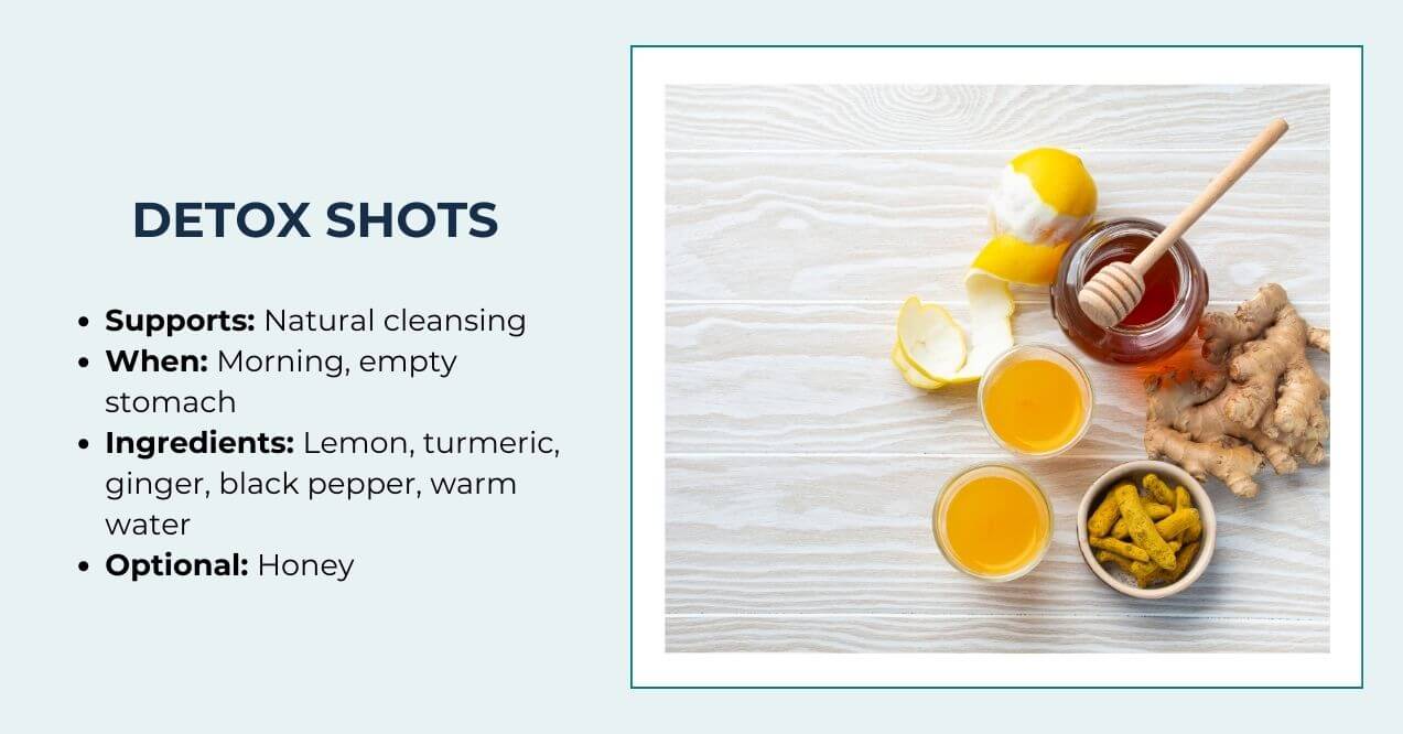 Detox shot setup with lemon, ginger, honey, and turmeric on a white surface
