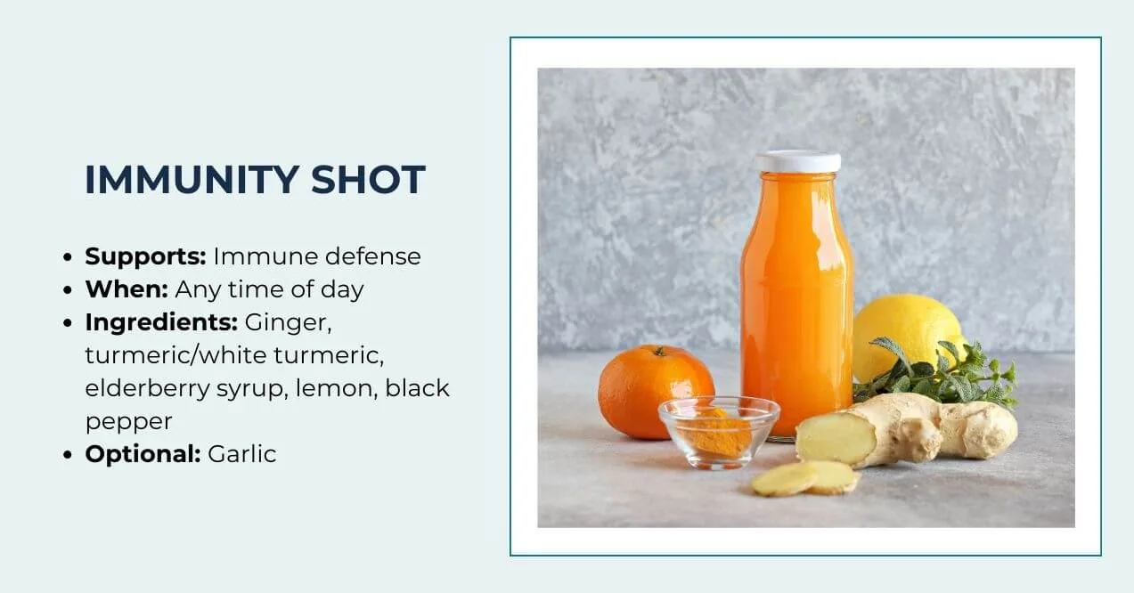 Orange immunity shot with ginger, lemon, turmeric, and elderberry ingredients